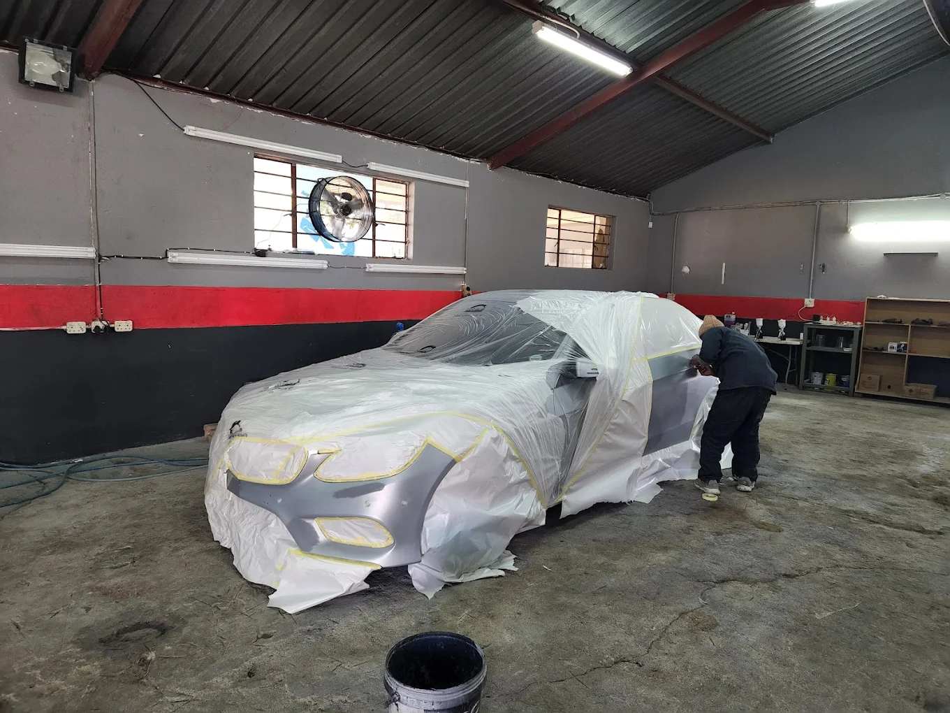 Car spray preparation and masking at panel shop in Centurion, LEGIT Auto Parts